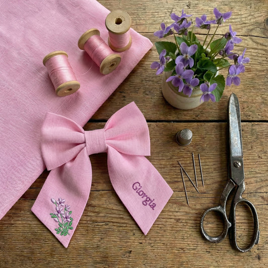 Personalised linen bow with embroidered customer name
