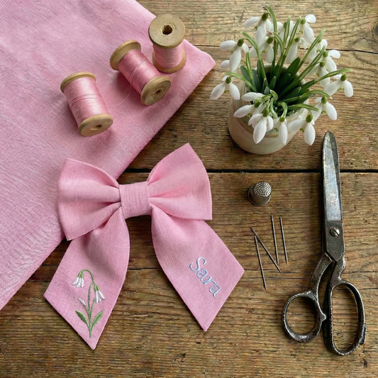 Personalised linen bow with embroidered customer name